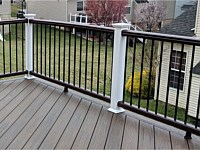 <b>Rum Deck Boards in a Diagonal Pattern with Trex composite railing in matching Spiced Rum with white composite posts and black aluminum balusters in Ellicott City MD</b>